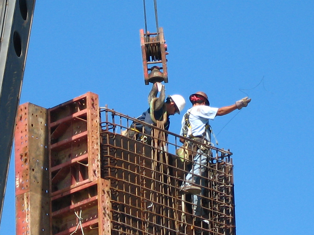 A construction worker framing a building